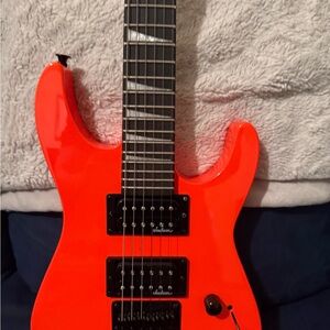 JACKSON Electric Guitar in Bright Red
